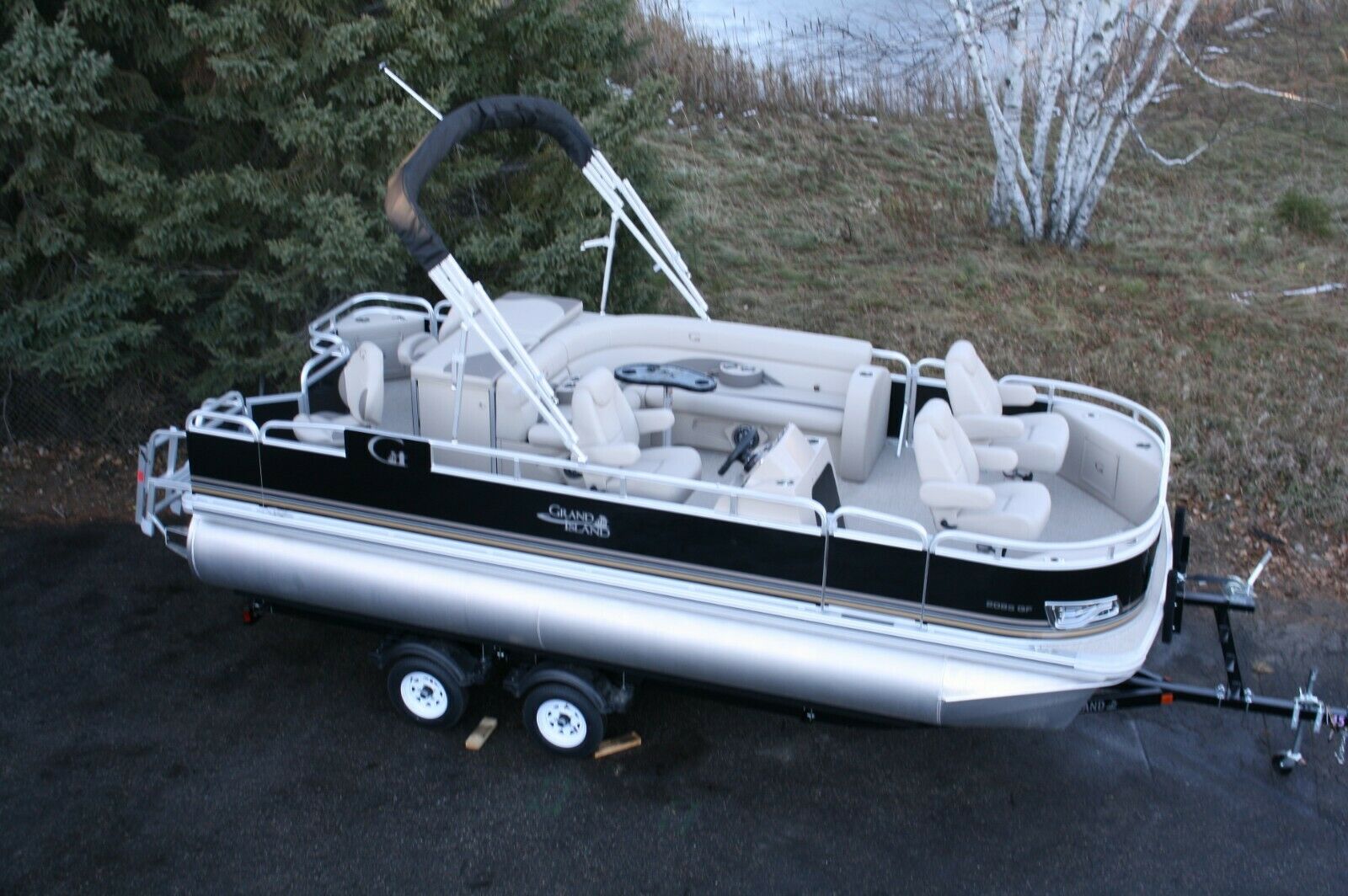 Triple tube New 20  fish and fun pontoon boat-150 four stroke and trailer