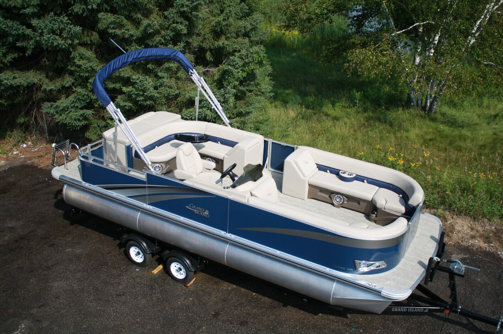 Two tube-New 24 ft pontoon boat with 115 hp and trailer